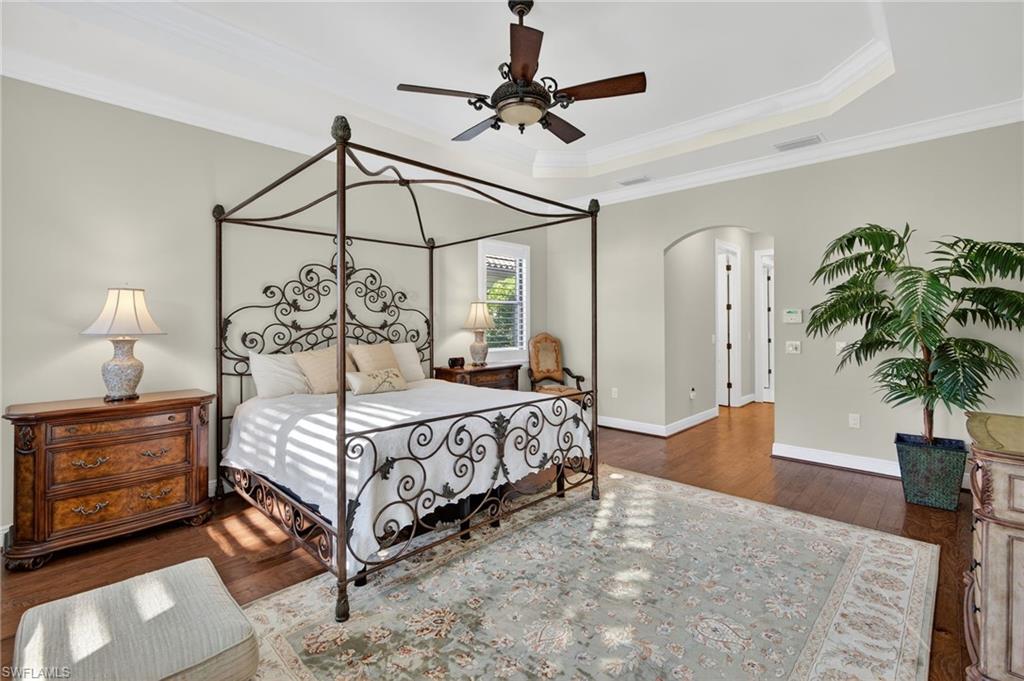 14495 Marsala Way Naples, FL 34109 - Photo 15 of 45 a bedroom with a bed window and a potted plant