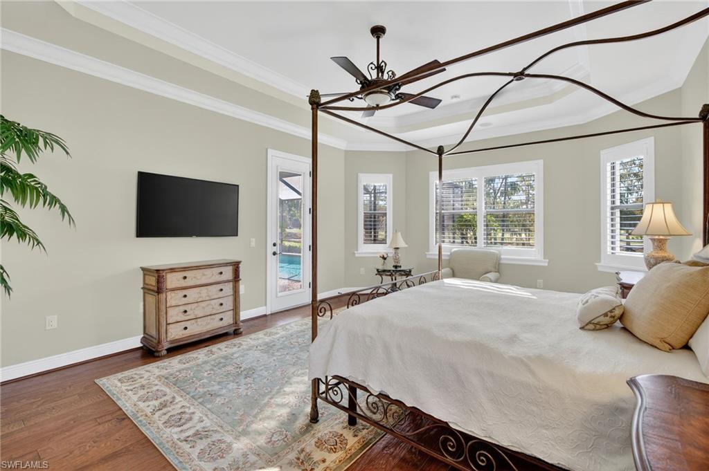 14495 Marsala Way Naples, FL 34109 - Photo 16 of 45 a bedroom with furniture and flat screen tv