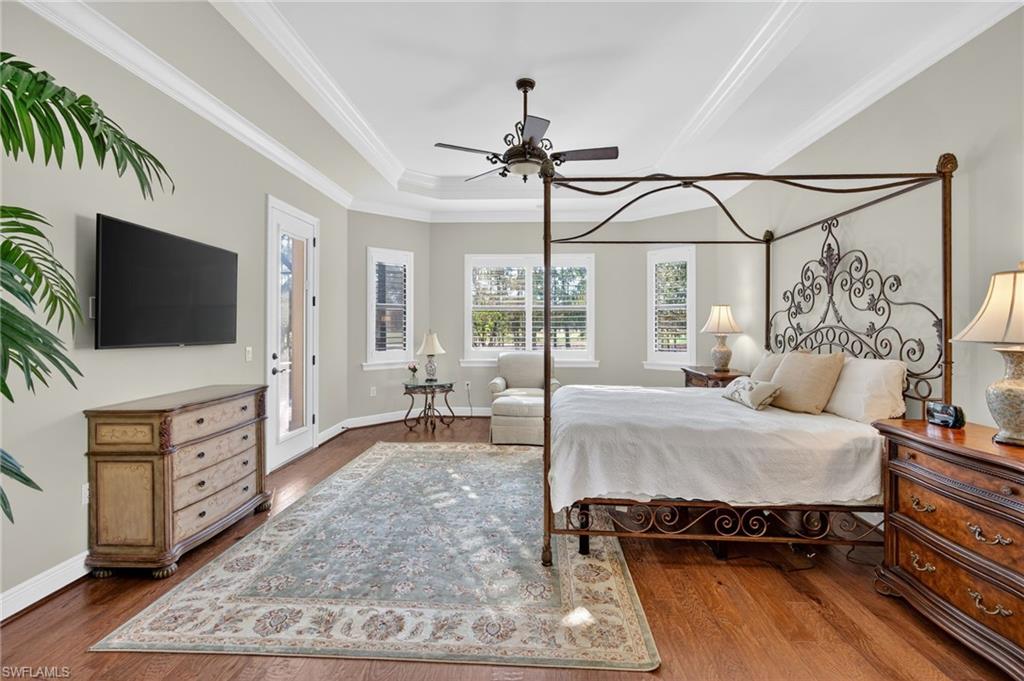 14495 Marsala Way Naples, FL 34109 - Photo 17 of 45 a bed room with furniture and a flat screen tv