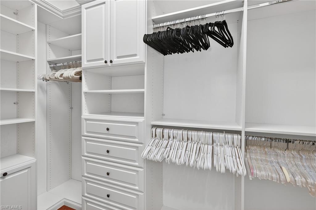 14495 Marsala Way Naples, FL 34109 - Photo 20 of 45 a view of walk in closet with empty racks
