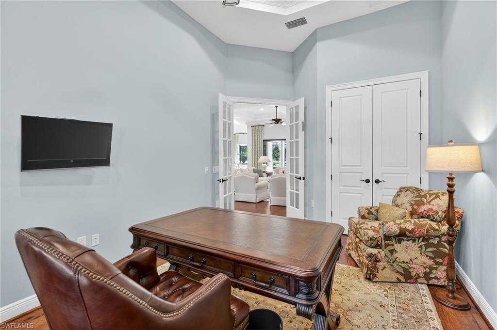 14495 Marsala Way Naples, FL 34109 - Photo 22 of 45 a living room with furniture and a flat screen tv