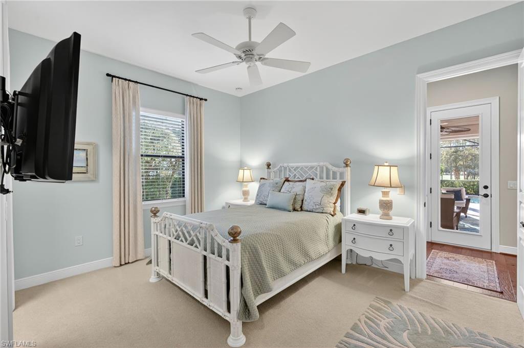 14495 Marsala Way Naples, FL 34109 - Photo 27 of 45 a bedroom with a bed and a flat tv screen on dresser