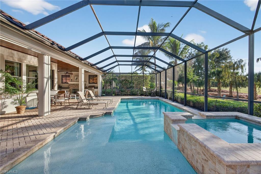 14495 Marsala Way Naples, FL 34109 - Photo 32 of 45 a view of a patio with a table and chairs