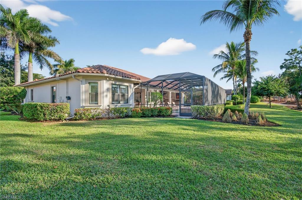 14495 Marsala Way Naples, FL 34109 - Photo 36 of 45 a front view of a house with a garden