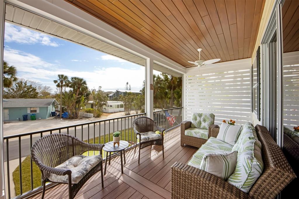 220 82nd Street Holmes Beach, FL 34217 - Photo 18 of 35 a view of balcony with couch and chairs