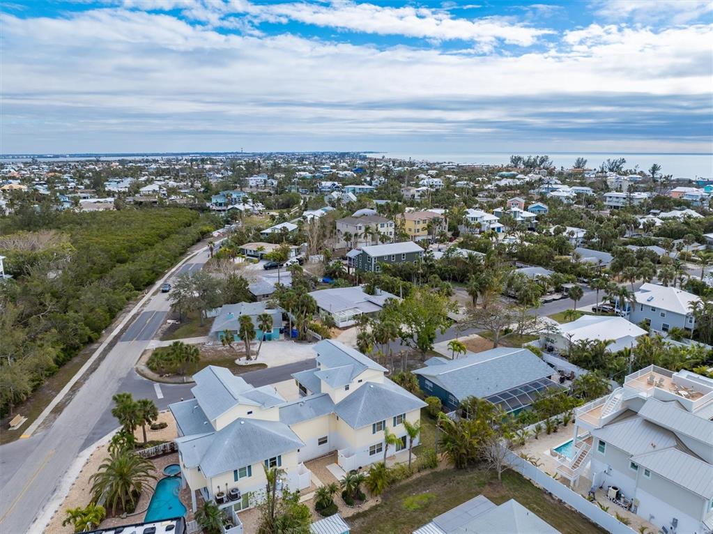 220 82nd Street Holmes Beach, FL 34217 - Photo 31 of 35 an aerial view of residential houses with outdoor space