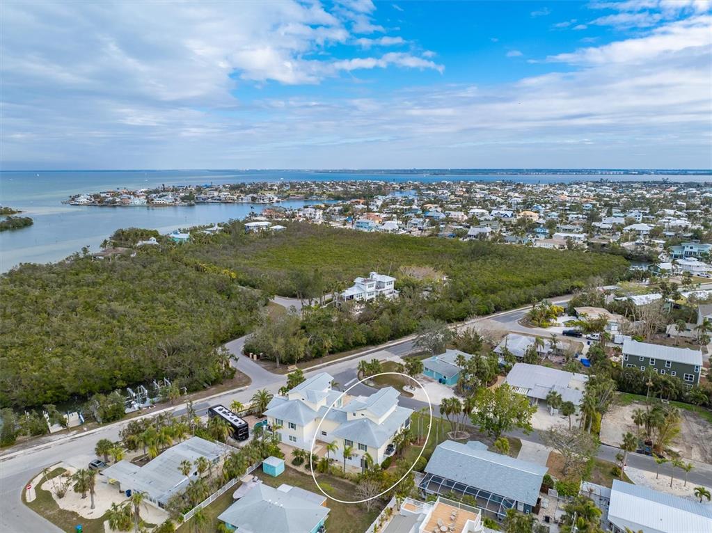 220 82nd Street Holmes Beach, FL 34217 - Photo 35 of 35 an aerial view of a house with garden space and ocean view