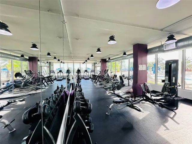 a view of storage and utility room with two washing machine