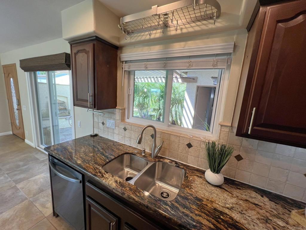 3801 Orange Way Oceanside, CA 92057 - Photo 27 of 52 a kitchen with a sink and a window