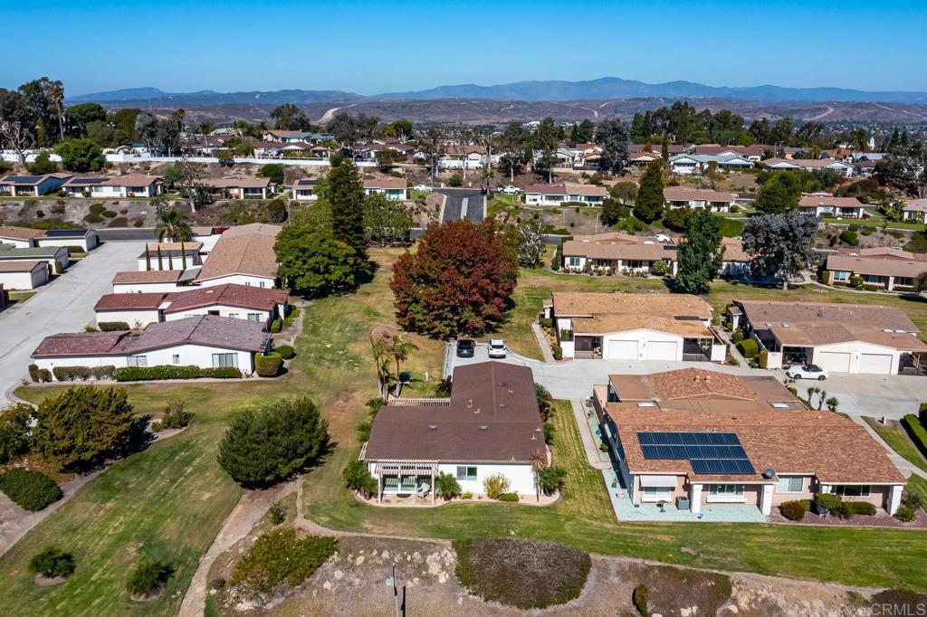 3801 Orange Way Oceanside, CA 92057 - Photo 47 of 52 an aerial view of residential houses with outdoor space and trees