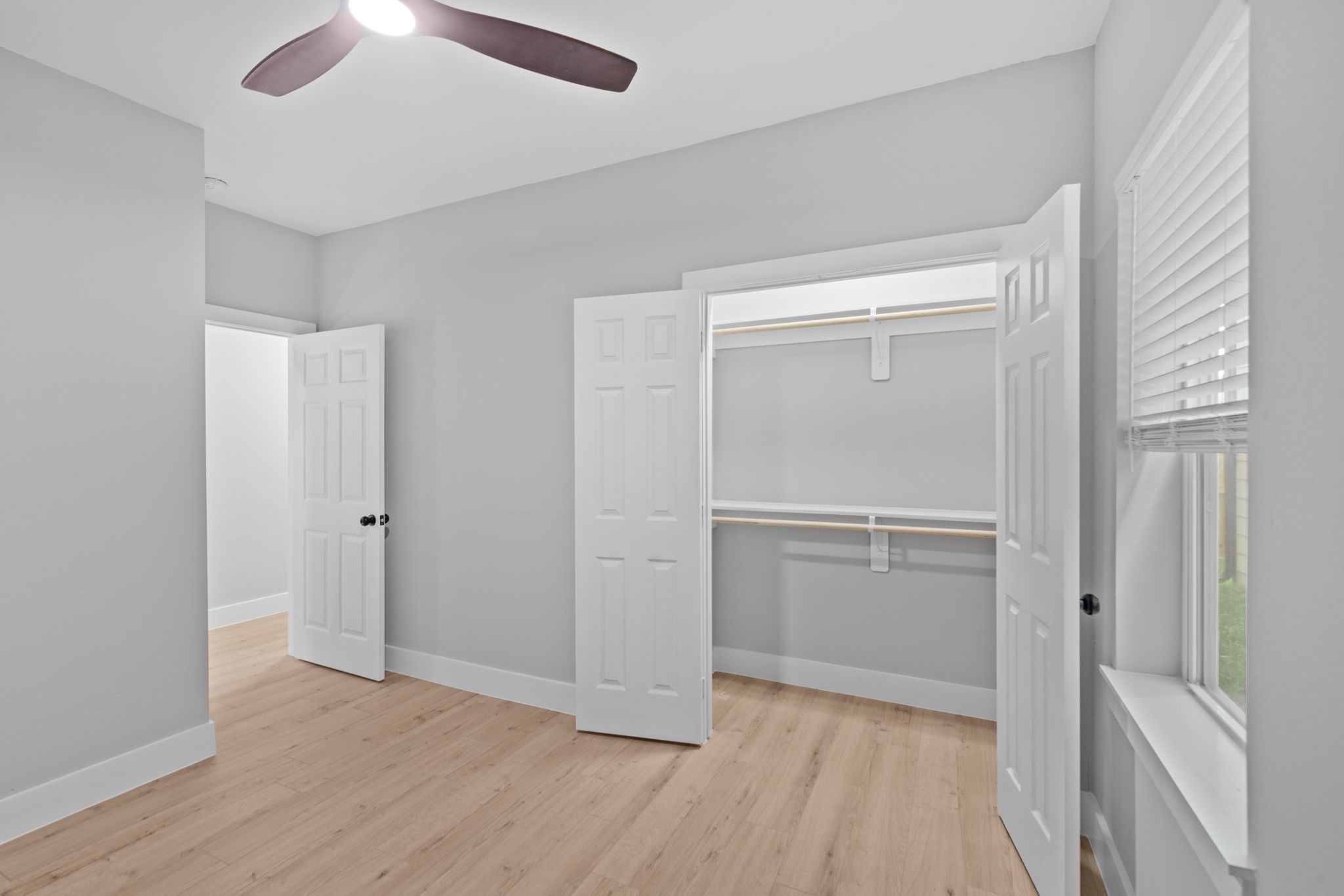 9918 Fillmore Street Houston, TX 77029 - Photo 14 of 35 a view of empty room with wooden floor and fan
