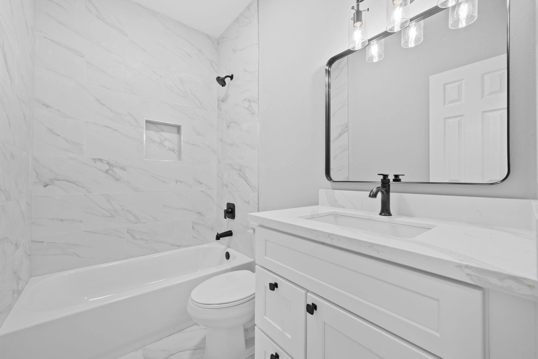 9918 Fillmore Street Houston, TX 77029 - Photo 17 of 35 a bathroom with a sink a toilet and a bathtub