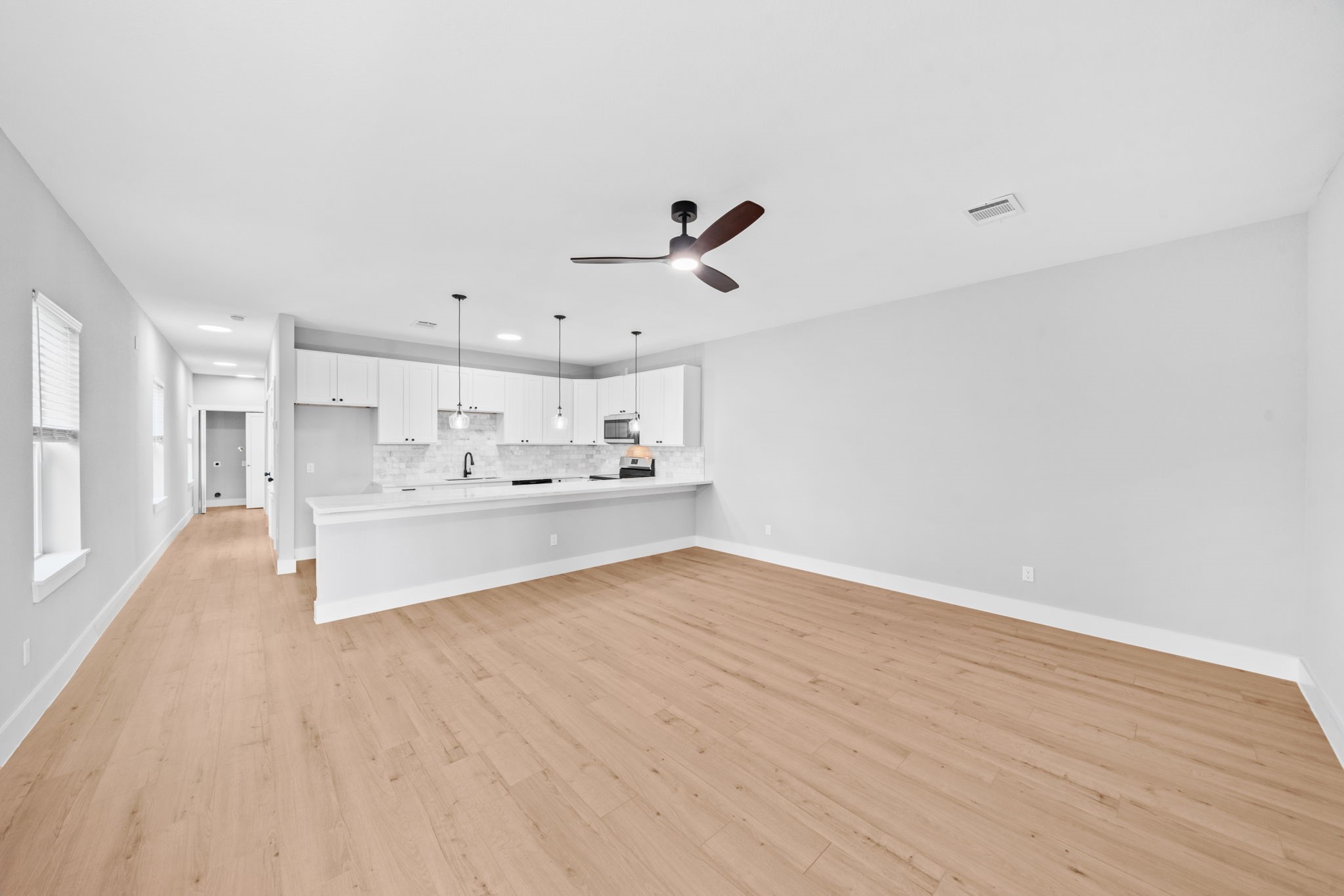 9918 Fillmore Street Houston, TX 77029 - Photo 21 of 35 a view of kitchen view with wooden floor and cabinets