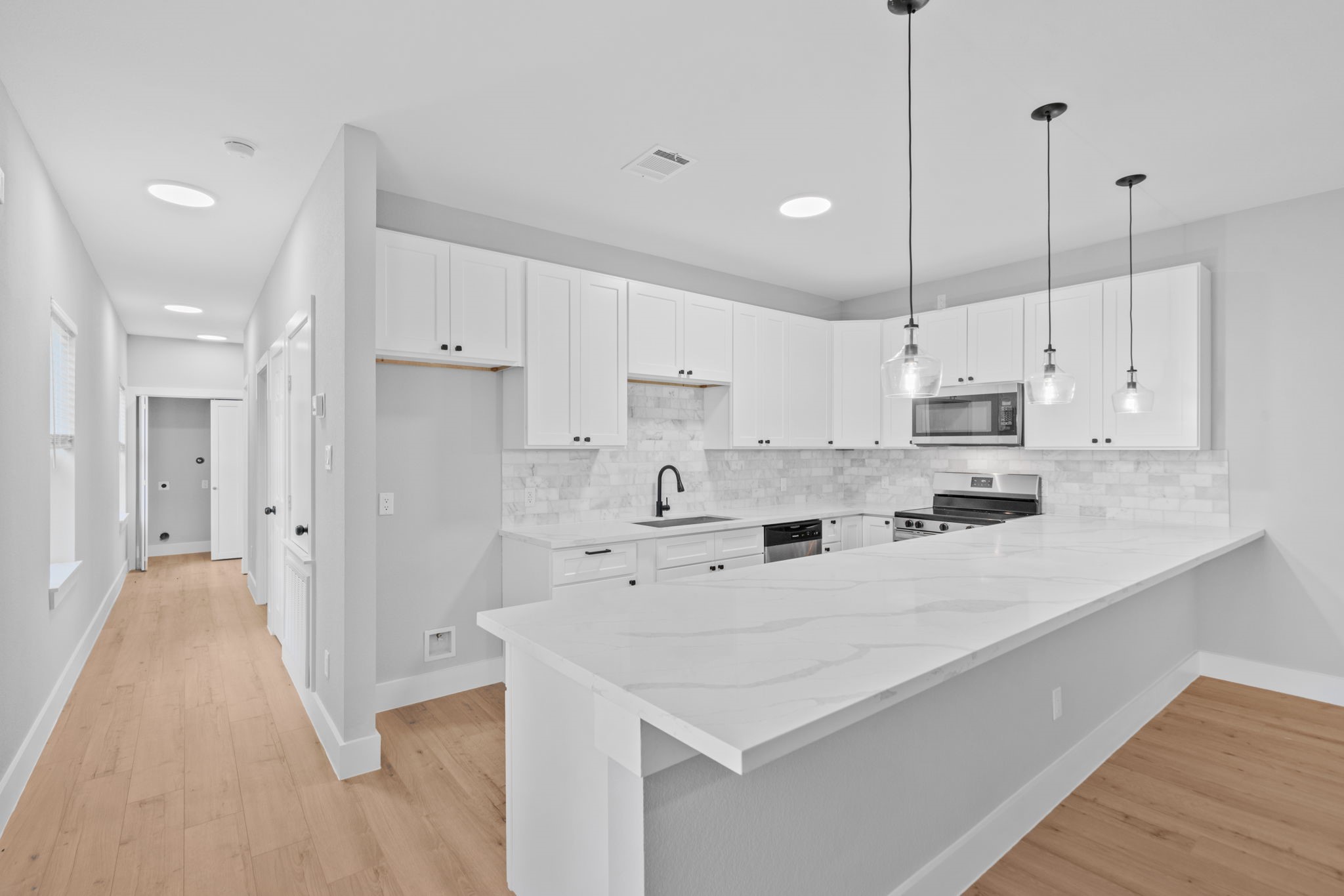 9918 Fillmore Street Houston, TX 77029 - Photo 25 of 35 a kitchen with white cabinets and white appliances