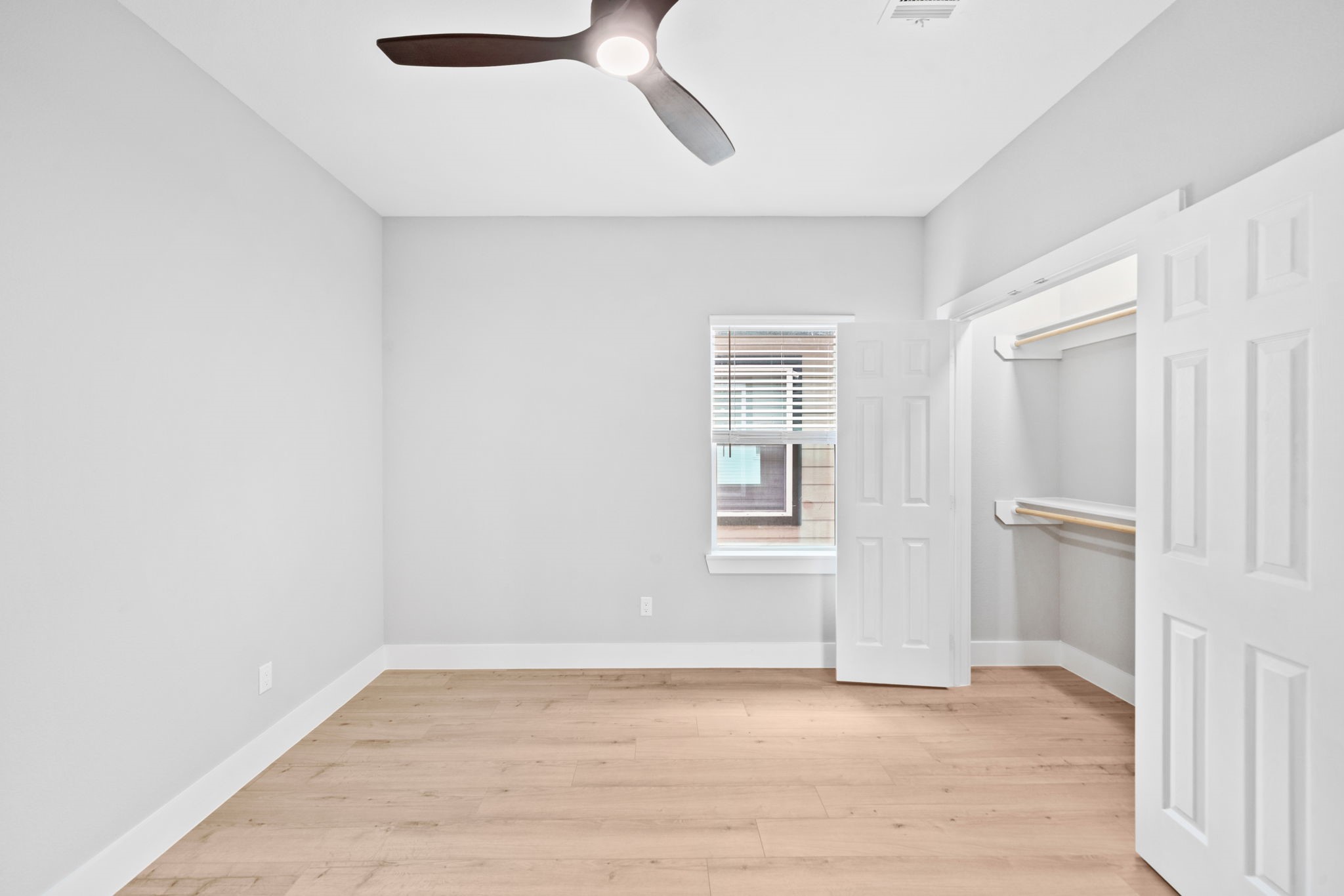 9918 Fillmore Street Houston, TX 77029 - Photo 31 of 35 an empty room with wooden floor cabinet and windows