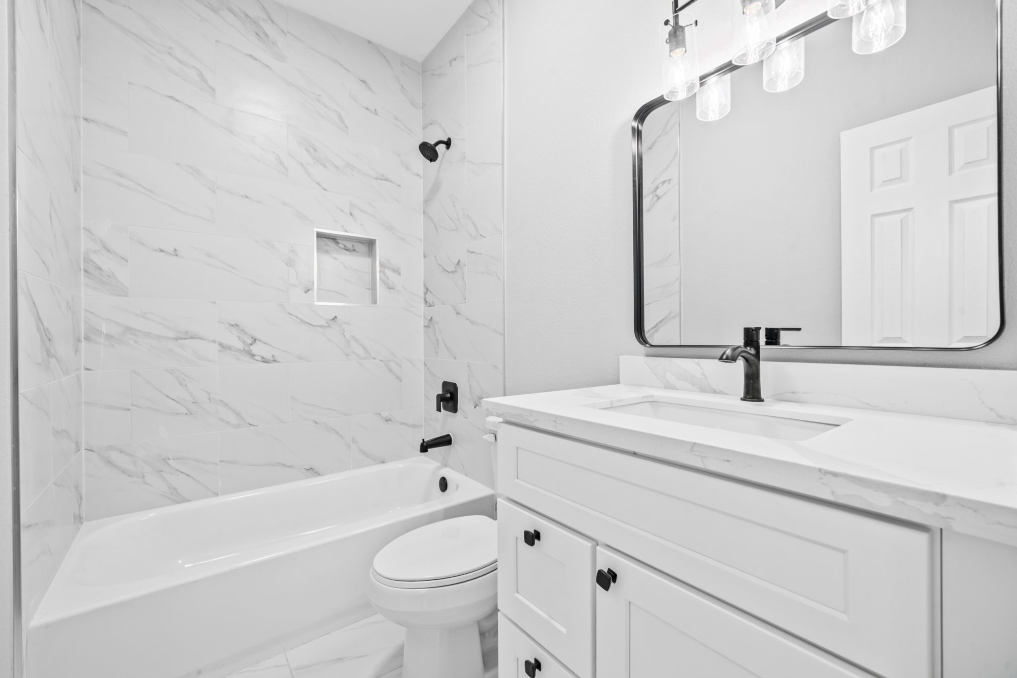 9918 Fillmore Street Houston, TX 77029 - Photo 34 of 35 a bathroom with a sink a toilet and a bathtub