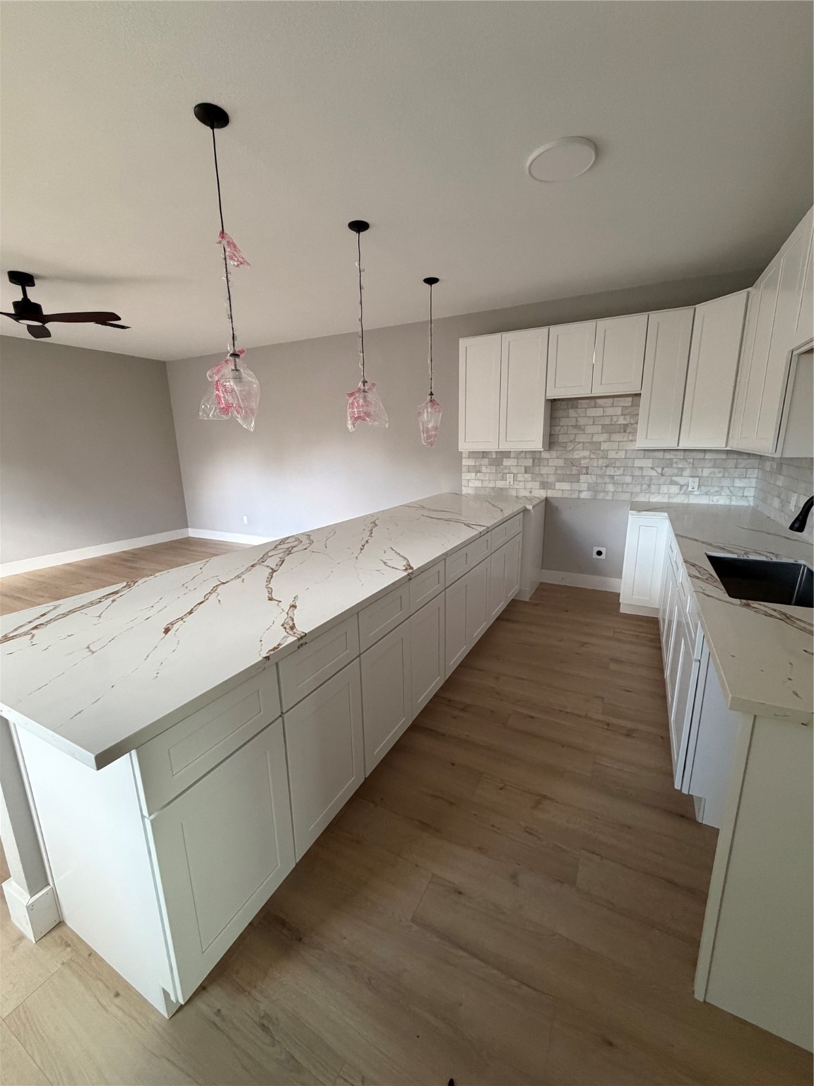 9918 Fillmore Street Houston, TX 77029 - Photo 5 of 11 a kitchen with stainless steel appliances granite countertop a sink a stove and a wooden floors