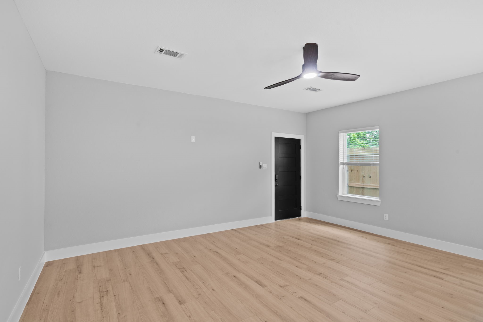9918 Fillmore Street Houston, TX 77029 - Photo 7 of 35 a view of an empty room with a window