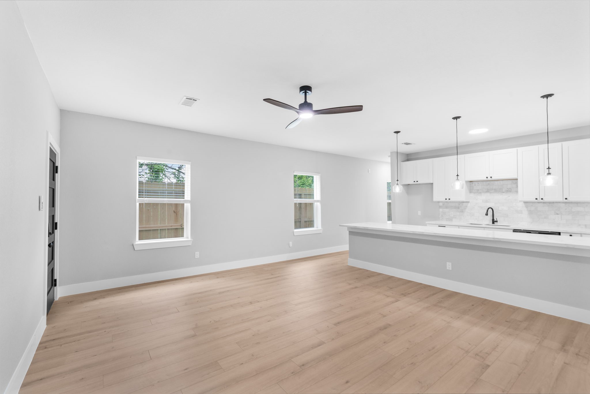 9918 Fillmore Street Houston, TX 77029 - Photo 8 of 35 a view of kitchen with window and wooden floor