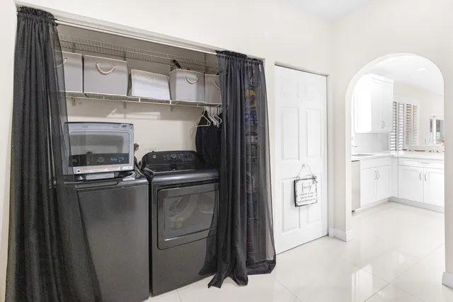a white toilet sitting next to a bathroom sink