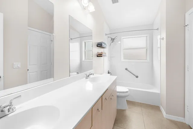 a large white bed in a white room