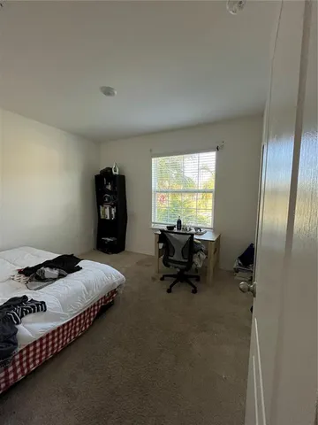 a bed room with furniture and a window