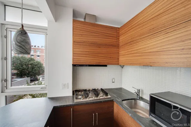 a kitchen with a sink and a stove
