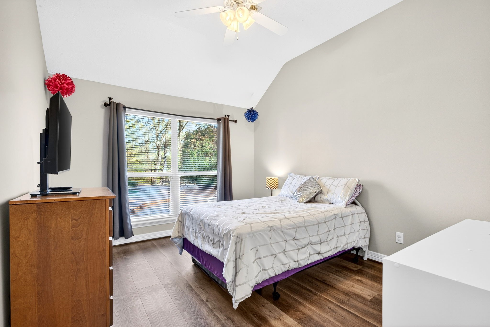 23620 Spring Branch Trail Montgomery, TX 77316 - Photo 18 of 27 The third bedroom offers a ceiling fan, backyard views, and a walk-in closet with built-ins.