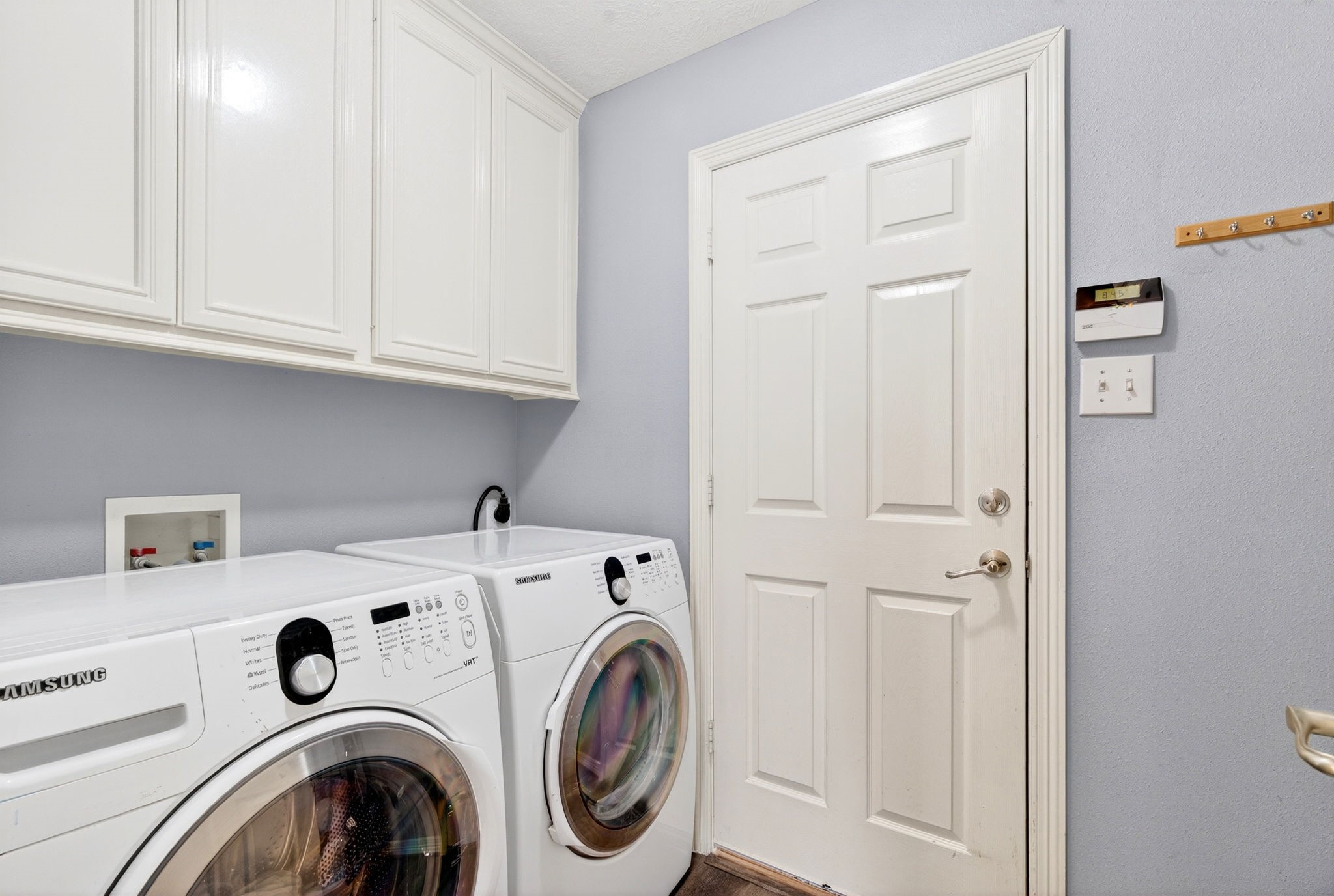 23620 Spring Branch Trail Montgomery, TX 77316 - Photo 19 of 27 The laundry room adds built-ins and space for a refrigerator or extra storage to keep life organized.