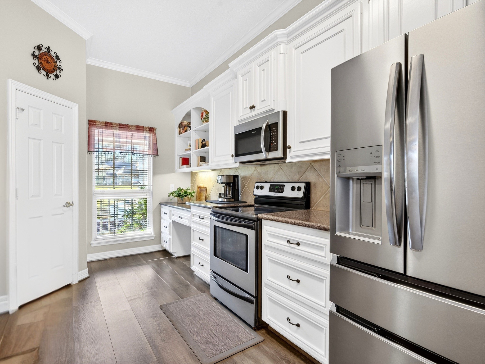 23620 Spring Branch Trail Montgomery, TX 77316 - Photo 6 of 27 A second view reveals the walk-in pantry and a window that brightens everyday prep.