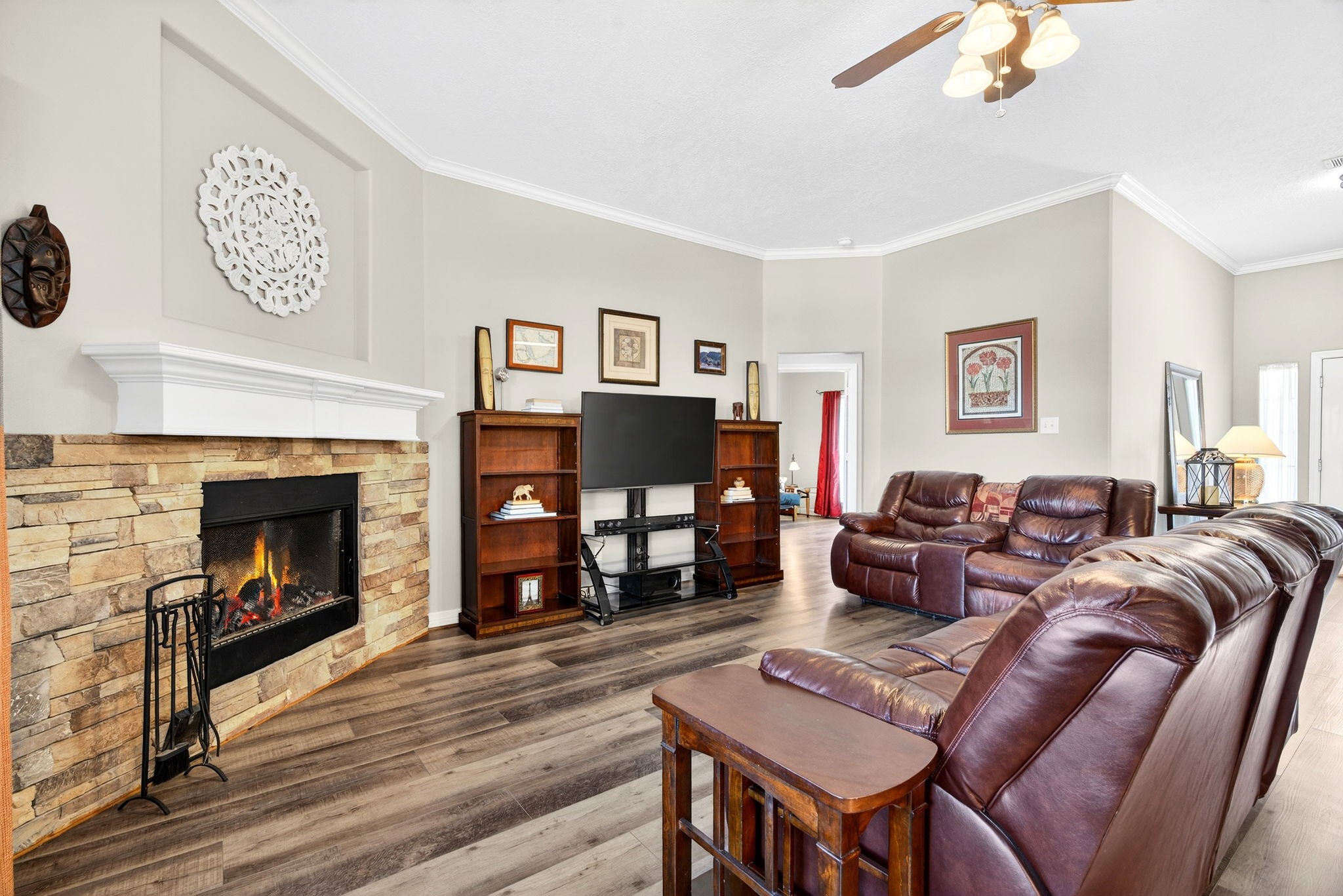 23620 Spring Branch Trail Montgomery, TX 77316 - Photo 9 of 27 A stone, wood-burning fireplace anchors cozy evenings and weekend gatherings.