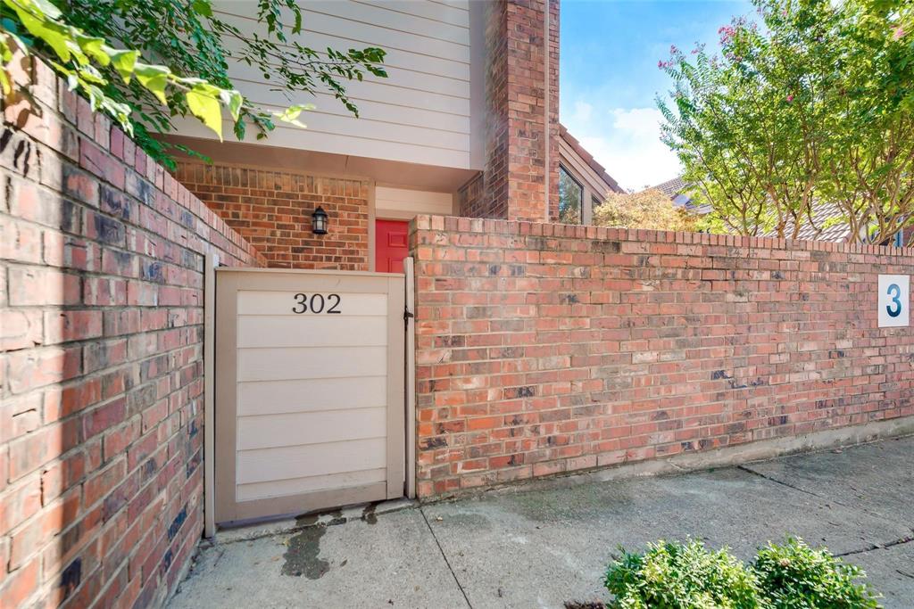 18240 Midway Road, Unit 302 Dallas, TX 75287 - Photo 33 of 33 a brick building with a door