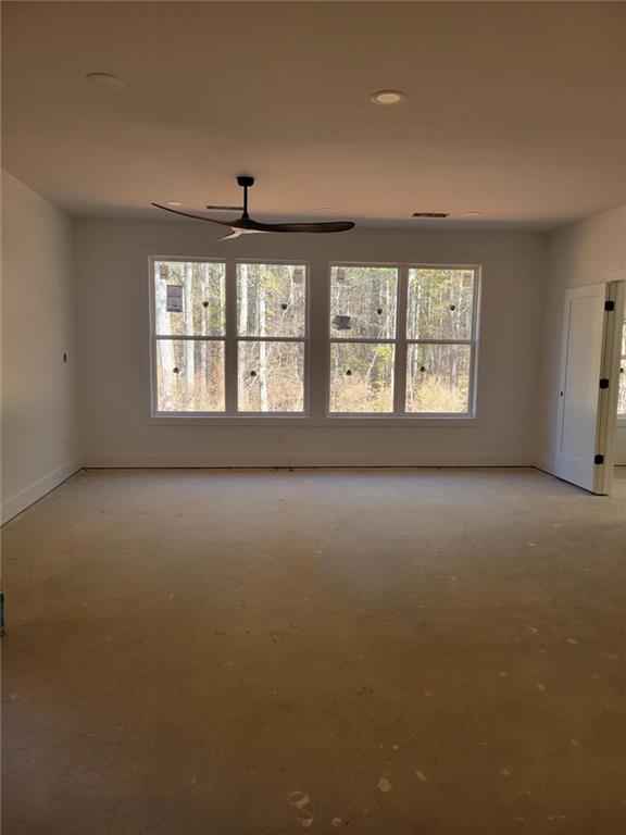 1150 Penland Road Covington, GA 30014 - Photo 12 of 17 an empty room with windows and windows