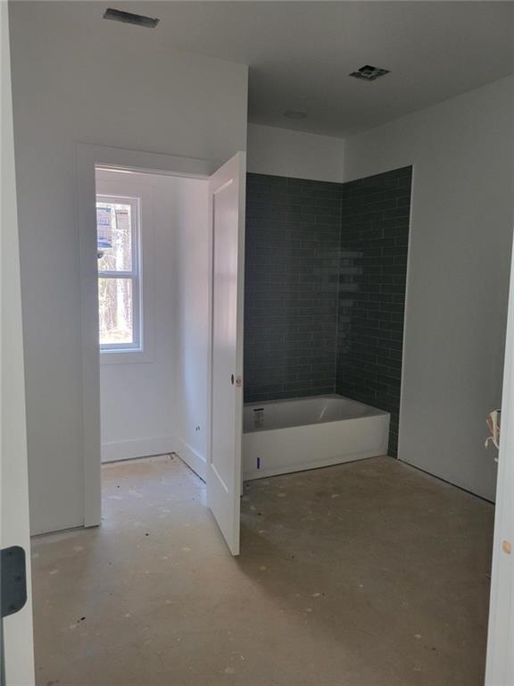 1150 Penland Road Covington, GA 30014 - Photo 14 of 17 a bathroom with a bathtub