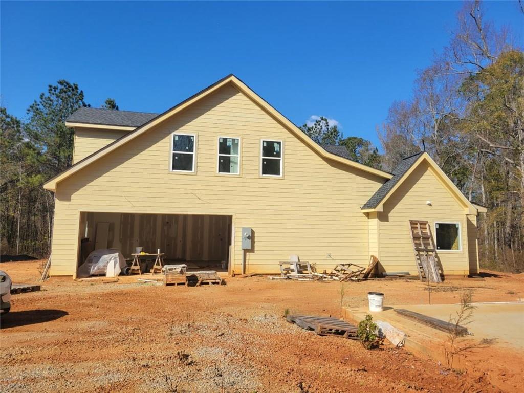 1150 Penland Road Covington, GA 30014 - Photo 2 of 17 a view of a house with a yard