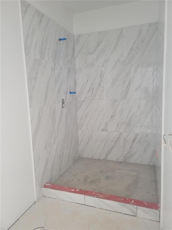 1150 Penland Road Covington, GA 30014 - Photo 9 of 17 a bathroom with a shower