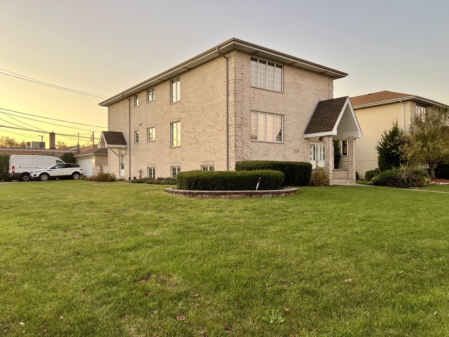 5348 6th Avenue, Unit 1 Countryside, IL 60525 - Photo 2 of 4 a front view of a house with a yard
