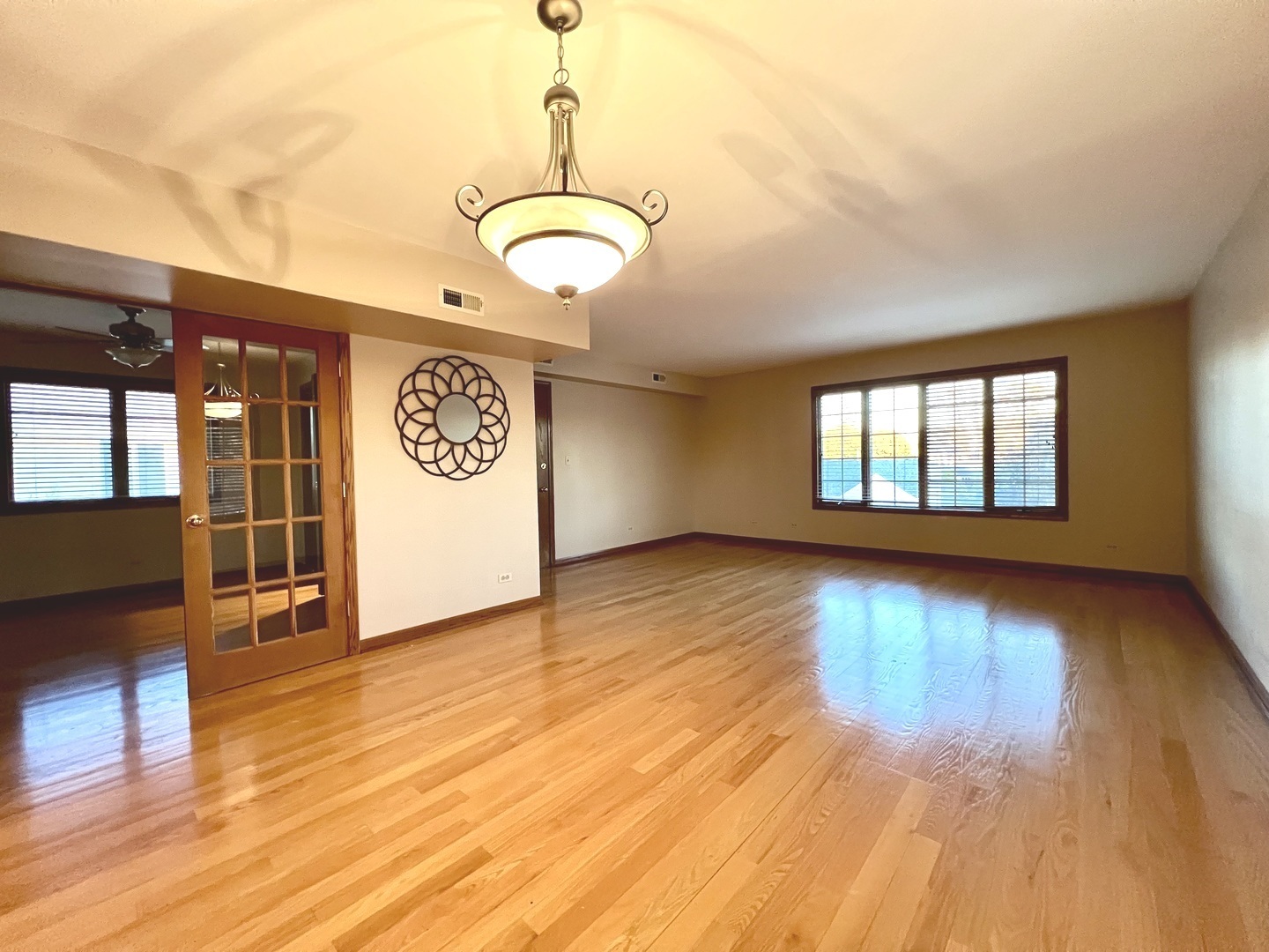 5348 6th Avenue, Unit 1 Countryside, IL 60525 - Photo 4 of 4 a view of an empty room with window and wooden floor