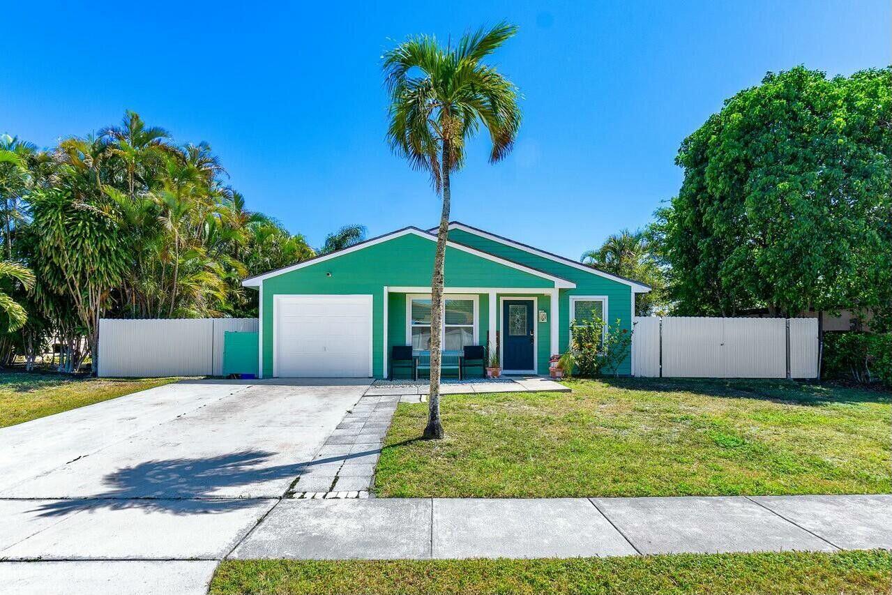 1102 Stardust Way Royal Palm Beach, FL 33411 - Photo 1 of 32 a front view of house with yard and green space