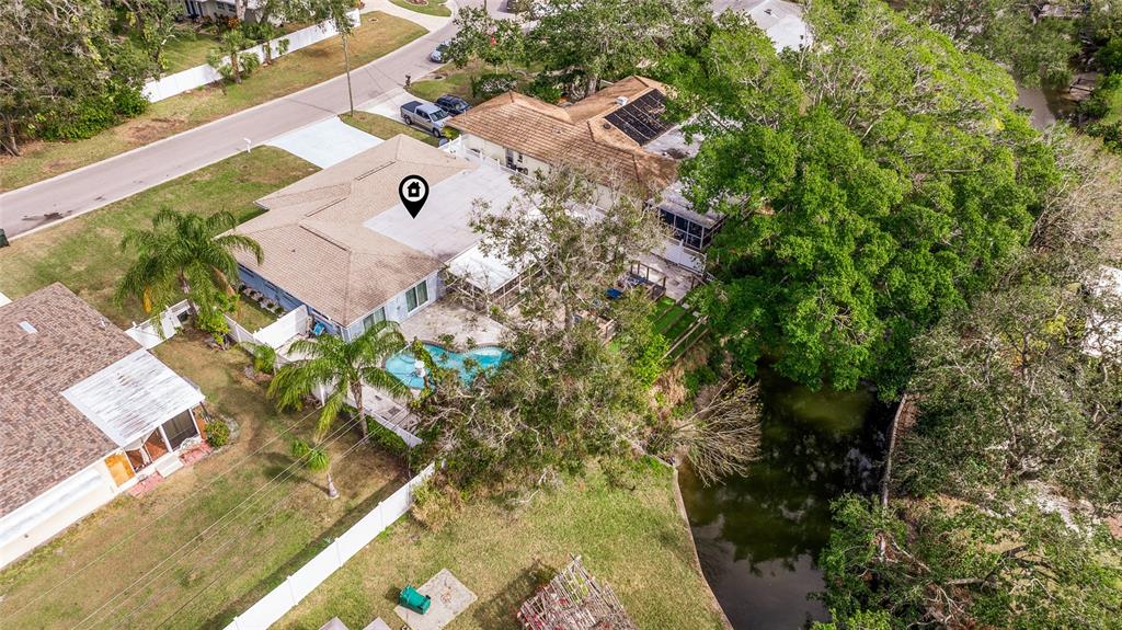 3282 Honeysuckle Road Largo, FL 33770 - Photo 7 of 44 an aerial view of a house with a yard and garden