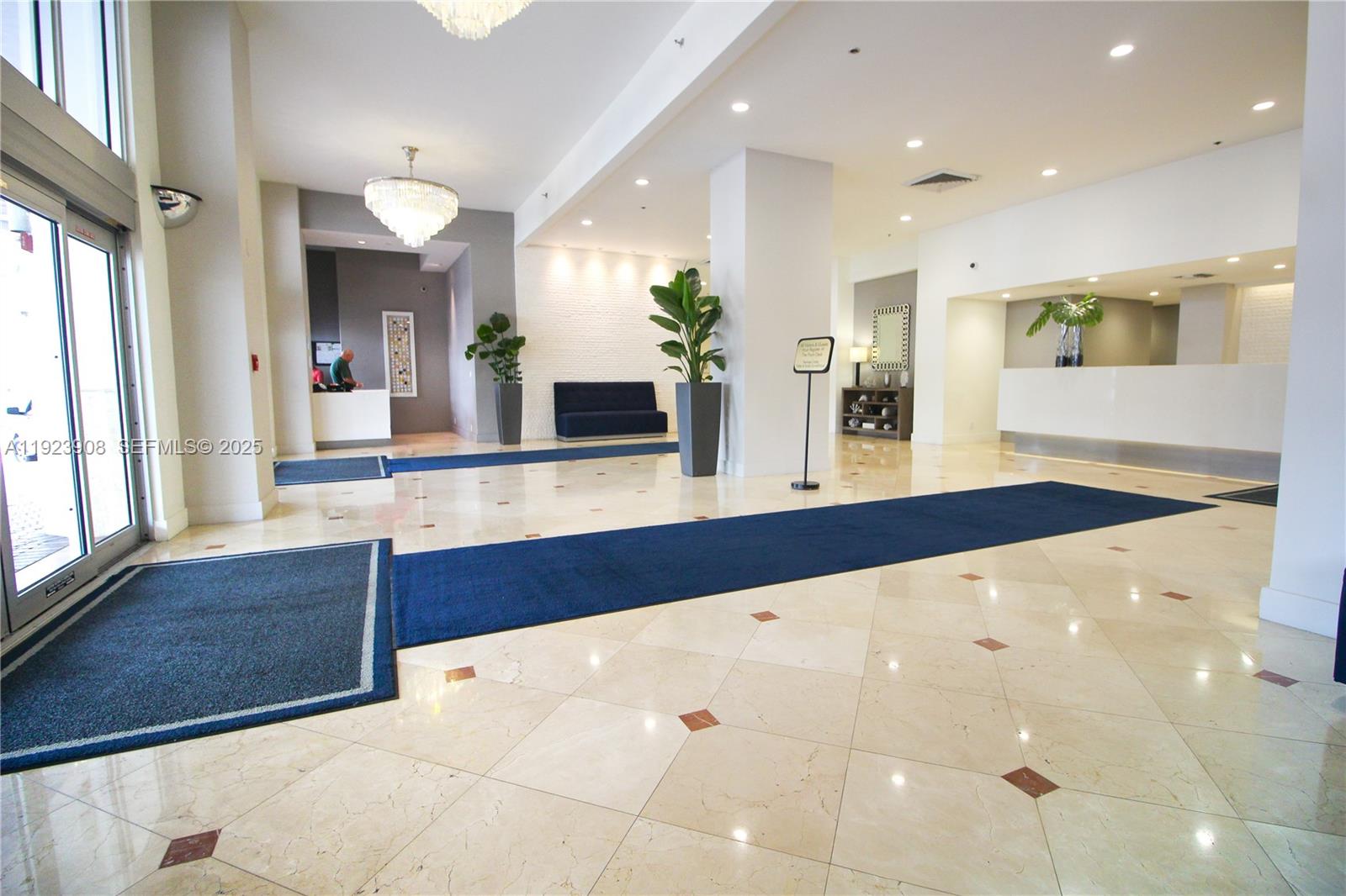 100 Lincoln Road, Unit 1515 Miami Beach, FL 33139 - Photo 12 of 23 a view of living room with kitchen island furniture and a flat screen tv