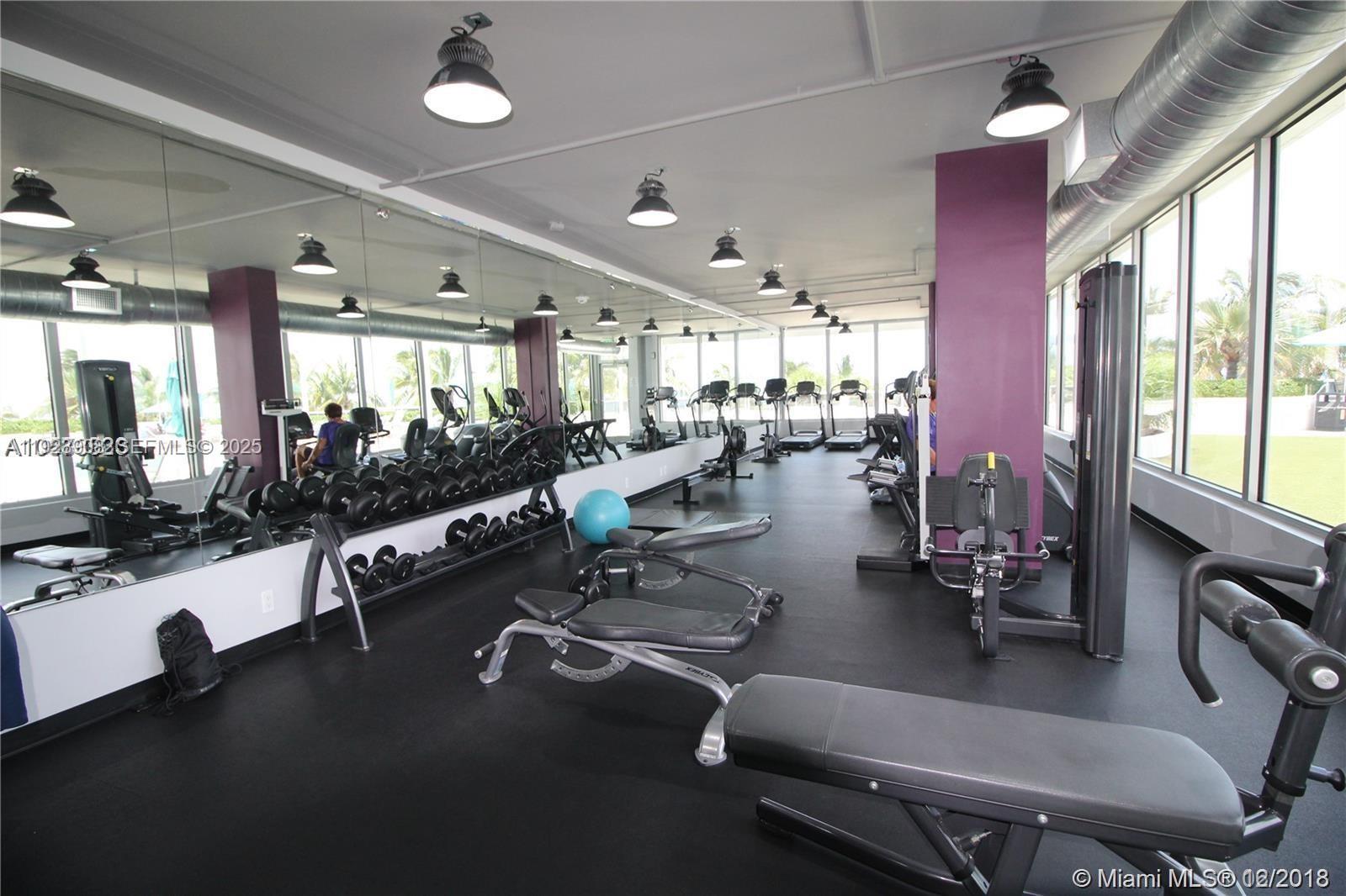 100 Lincoln Road, Unit 1515 Miami Beach, FL 33139 - Photo 14 of 23 a view of a room with gym equipment