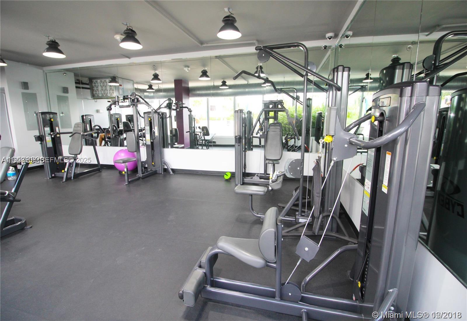 100 Lincoln Road, Unit 1515 Miami Beach, FL 33139 - Photo 15 of 23 a view of a room with gym equipment