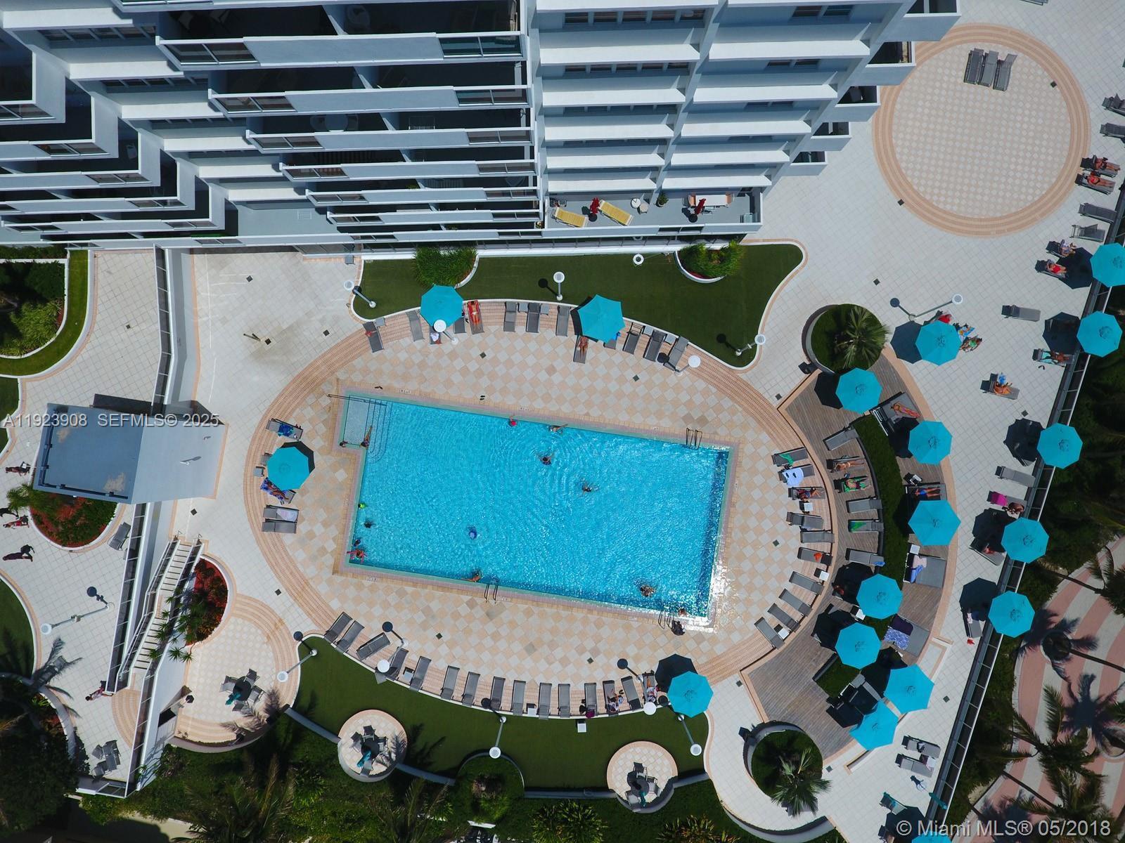 100 Lincoln Road, Unit 1515 Miami Beach, FL 33139 - Photo 19 of 23 a front view of a fireplace with lots of different kinds of items