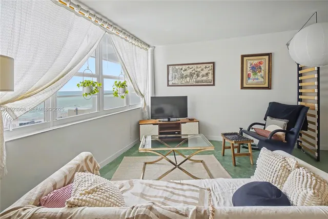 a living room with furniture and a window