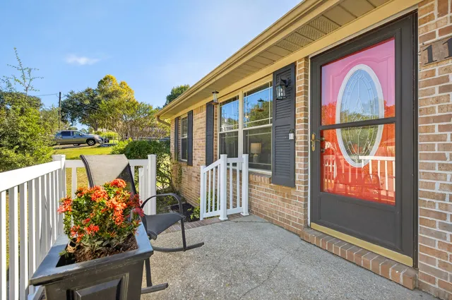a kitchen with granite countertop a sink stove and refrigerator