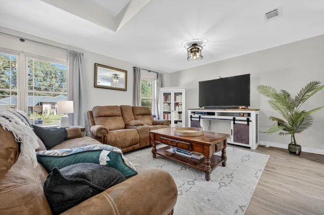 a kitchen with stainless steel appliances granite countertop a stove microwave and sink