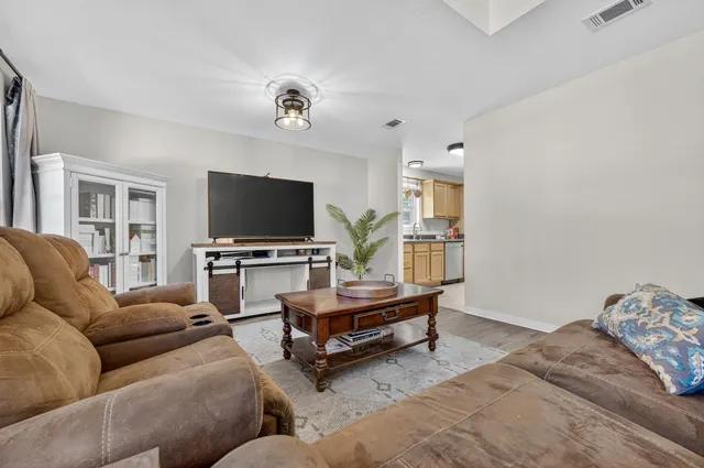 a kitchen with a sink and a granite counter top