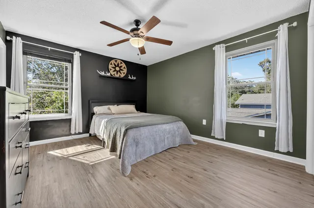 a view of a house with swimming pool and sitting area