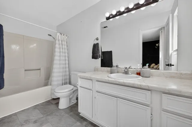 a view of a backyard with a large tree